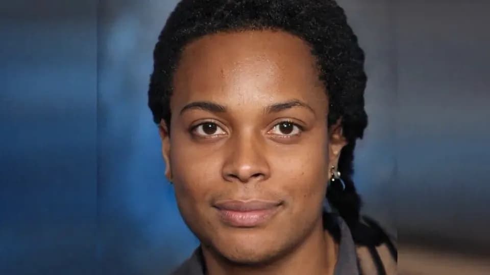 A frame of a video showing a woman's face that was made by an image generator